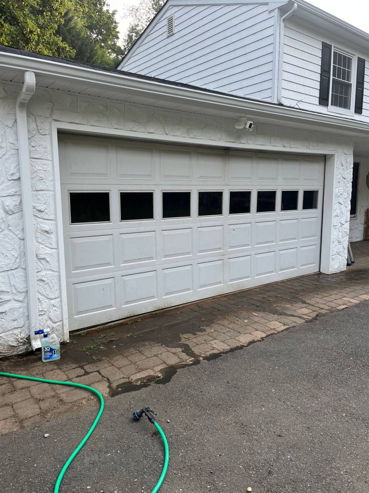 Before: the same garage with a dingy white door