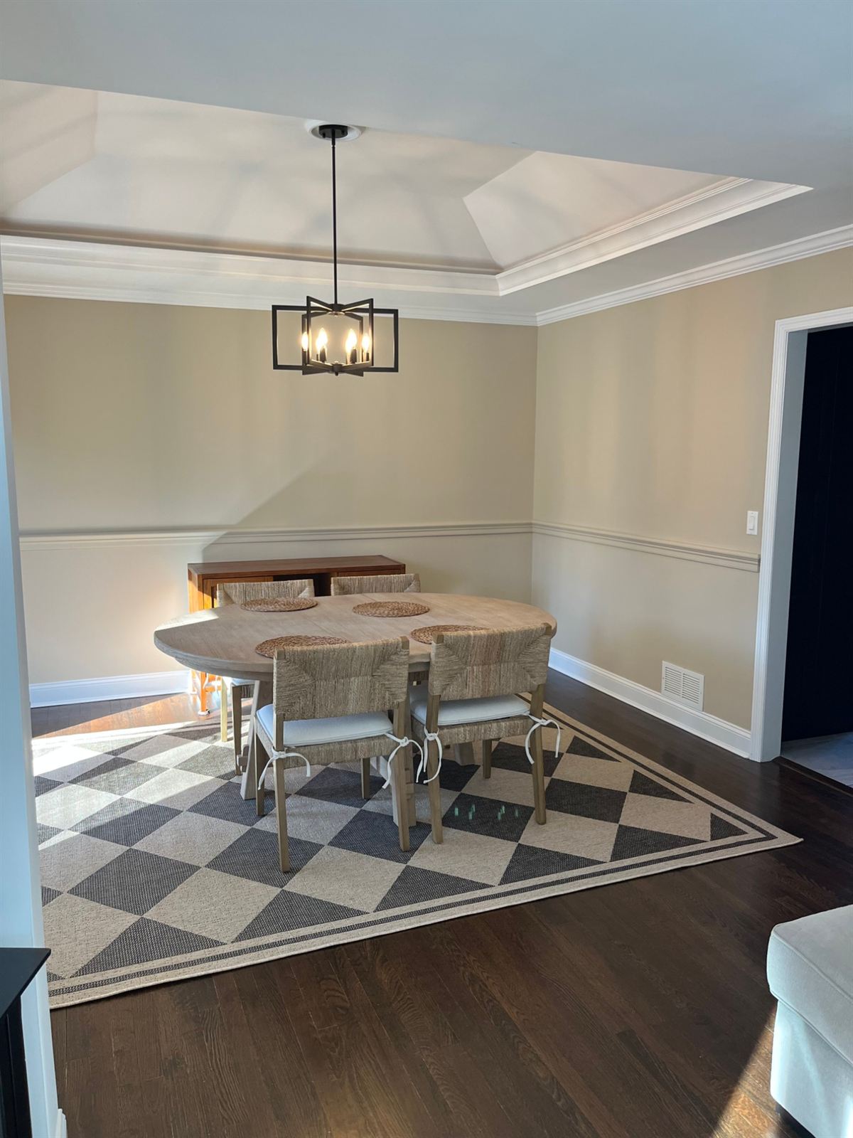 After: the same dining room repainted in warm tan